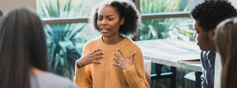 Woman expressing herself at group therapy